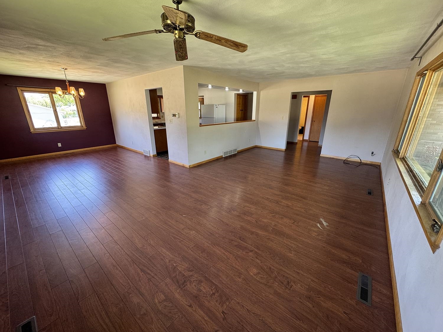 401 South Ridge Street Shannon, IL 61078 - Photo 10 of 40 a view of empty room with wooden floor and fan