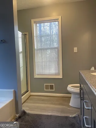 a bathroom with a toilet and a sink