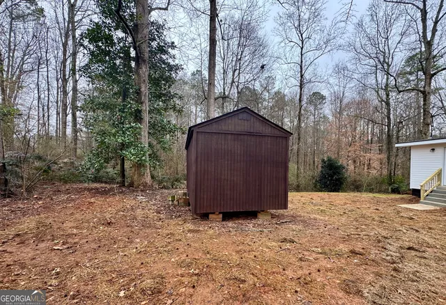 a wooden bench sitting in middle of forest