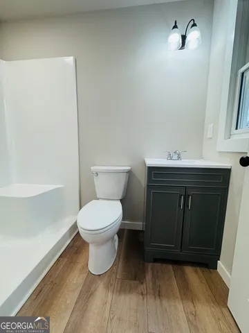 a bathroom with a toilet and a sink
