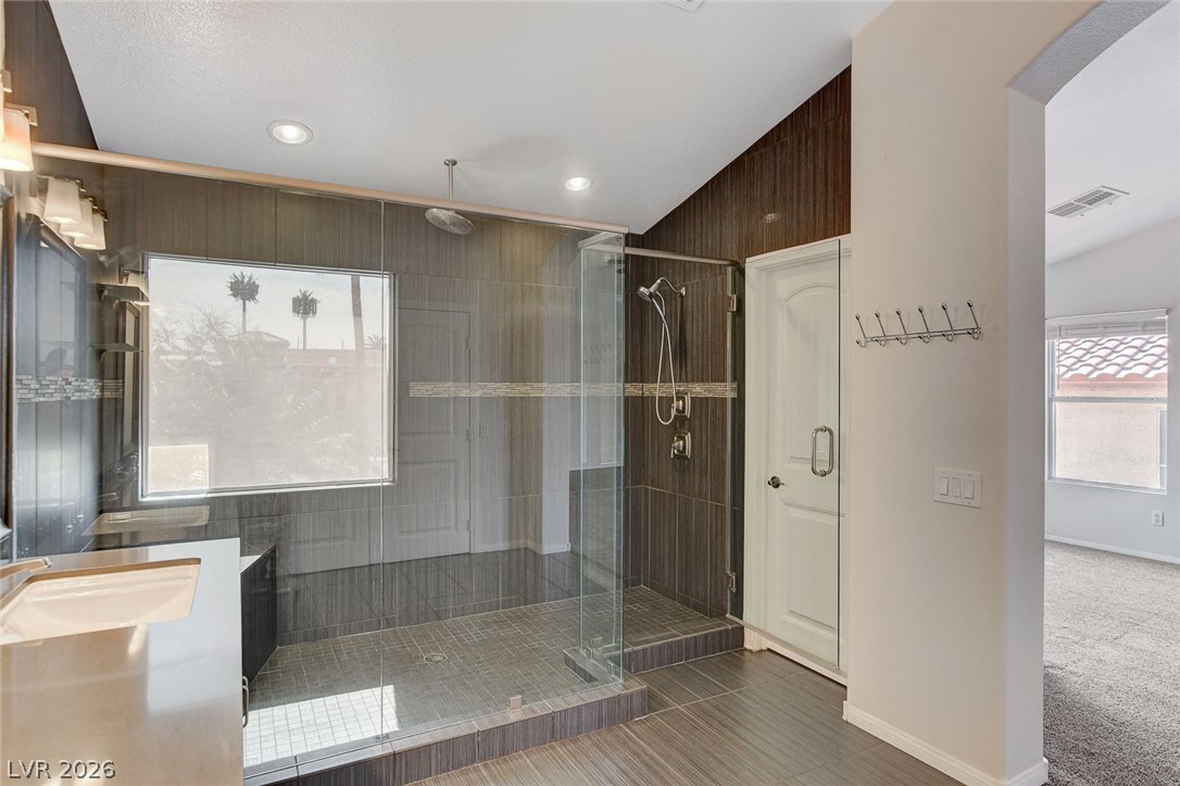 191 Verde Ridge Court Henderson, NV 89012 - Photo 23 of 36 Full bathroom featuring a shower stall, recessed lighting, baseboards, vanity, and tile patterned flooring