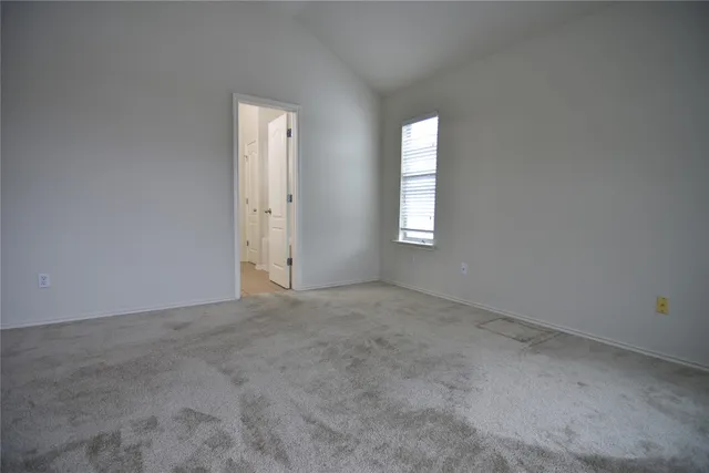a view of an empty room and entryway