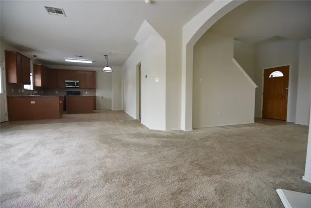 a view of a big room with windows and a bathroom
