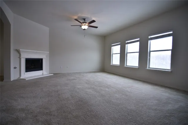 a view of empty room with windows