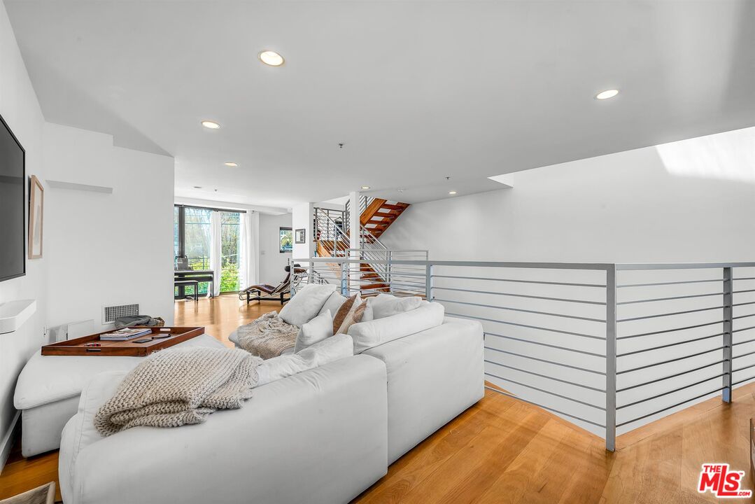815 Hampton Drive, Unit 5B Venice, CA 90291 - Photo 11 of 20 a bed room with a bed and a couch