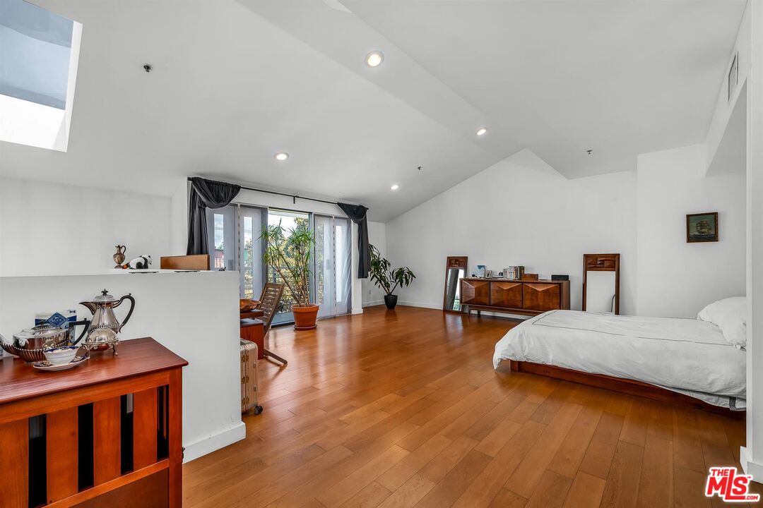 815 Hampton Drive, Unit 5B Venice, CA 90291 - Photo 12 of 20 a living room with furniture and a wooden floor