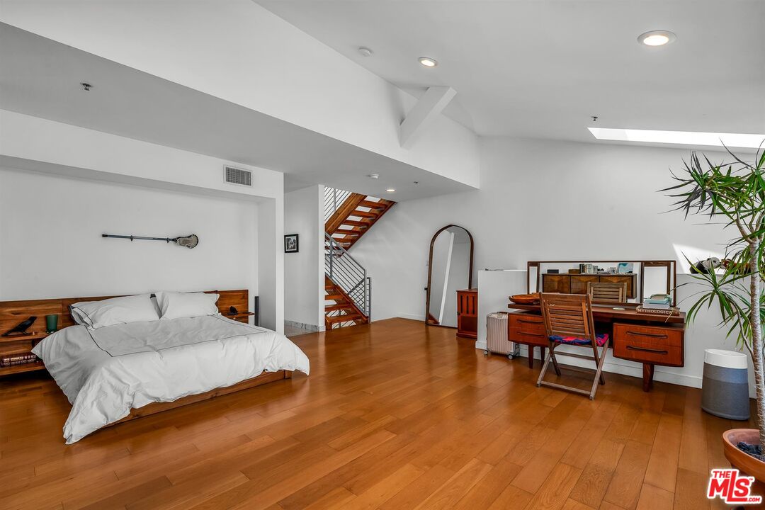 815 Hampton Drive, Unit 5B Venice, CA 90291 - Photo 13 of 20 a bedroom with furniture and a wooden floor