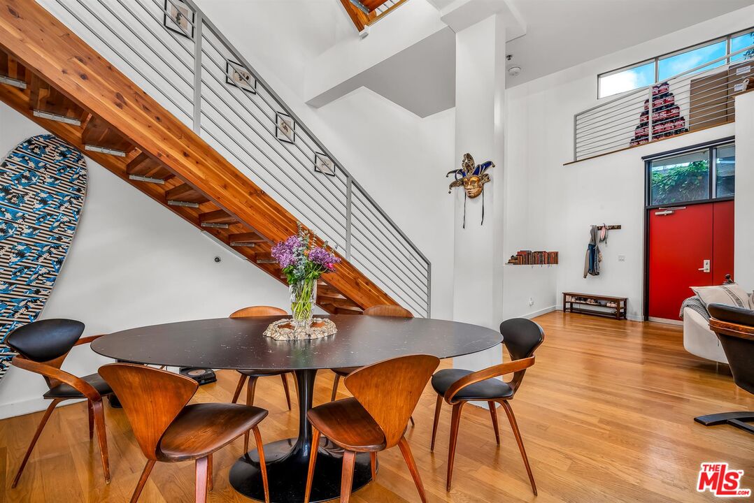 815 Hampton Drive, Unit 5B Venice, CA 90291 - Photo 7 of 20 a view of a dining room with chairs and wooden floor