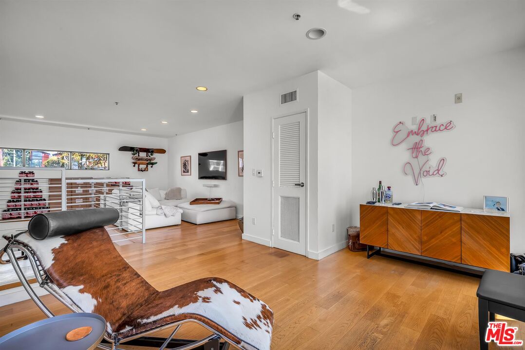 815 Hampton Drive, Unit 5B Venice, CA 90291 - Photo 9 of 20 a living room with furniture and wooden floor