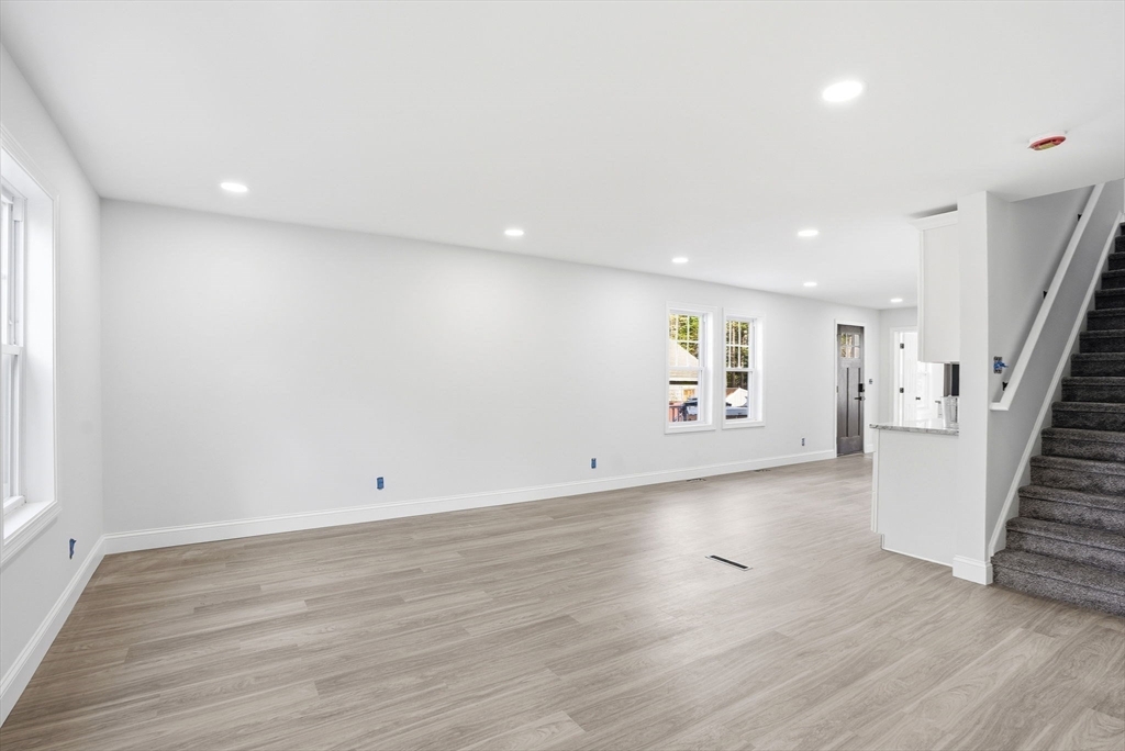 357 Wareham Street Middleboro, MA 02346 - Photo 15 of 42 an empty room with wooden floor and white walls