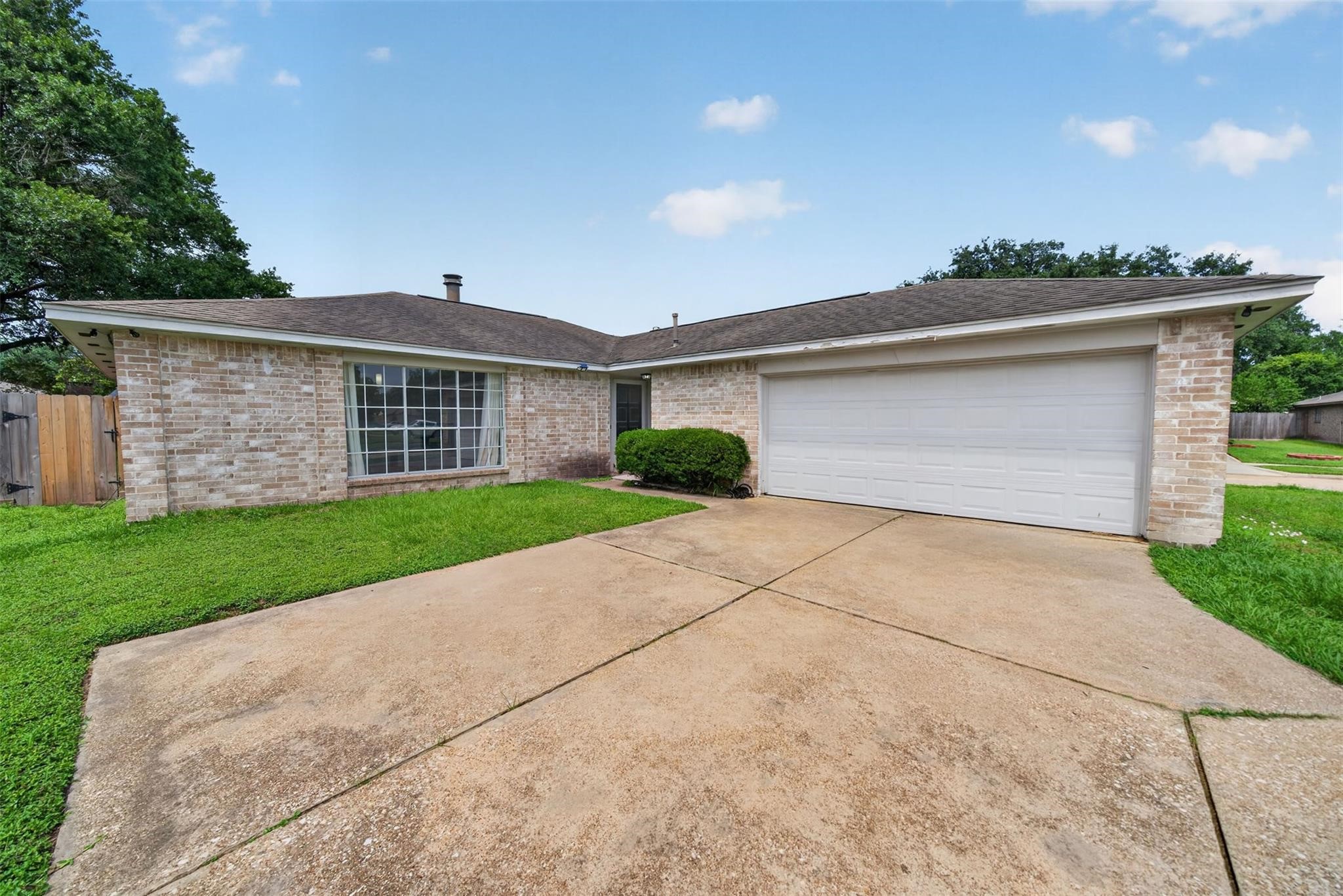 17002 Dew Drop Lane Houston, TX 77095 - Photo 24 of 24 a front view of a house with a yard and garage