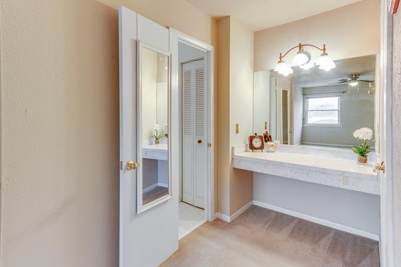 810 Bellevue Road, Unit 242 Nashville, TN 37221 - Photo 14 of 16 a bathroom with a sink vanity and a mirror