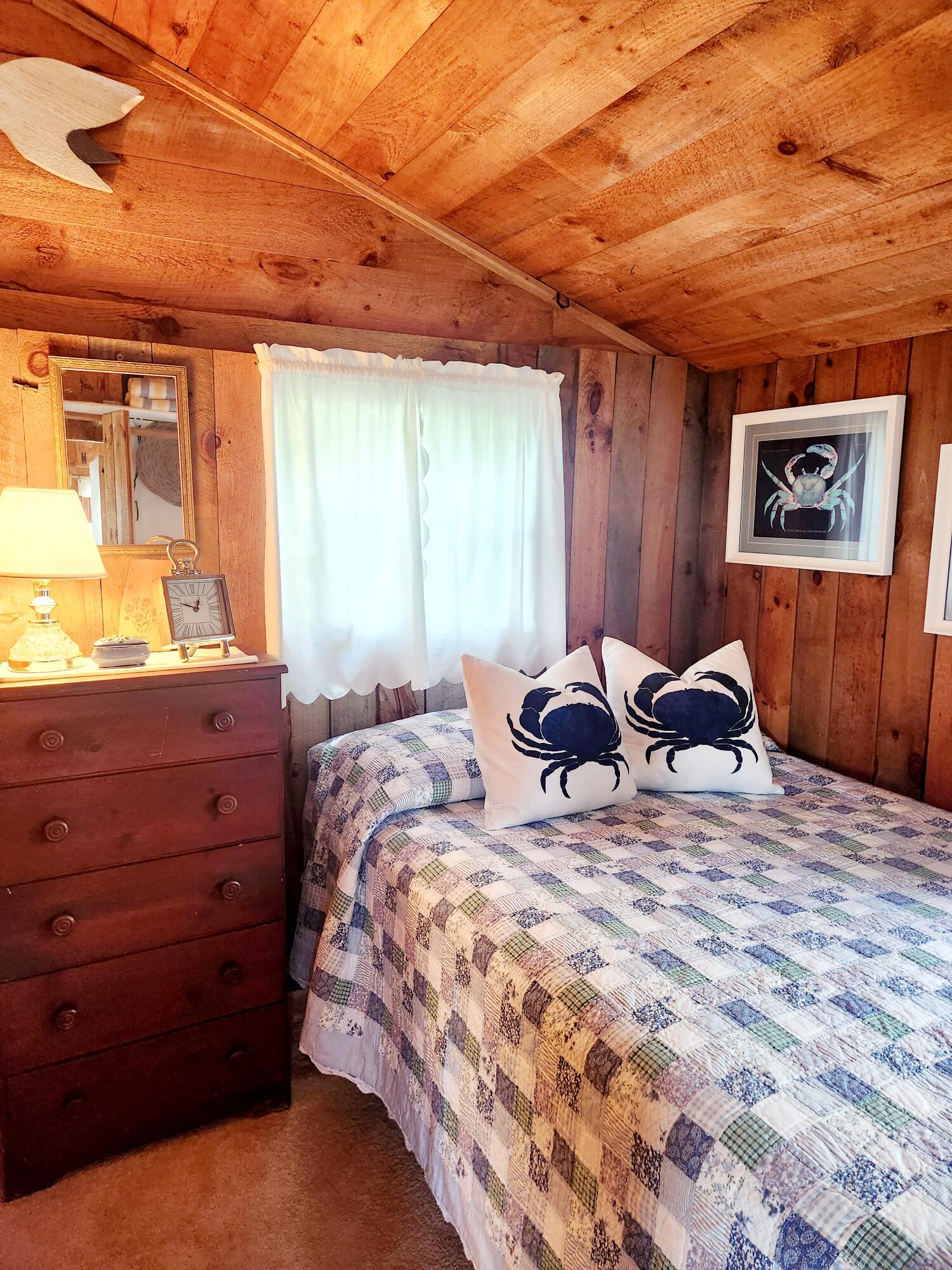 9 Windy Hill Road, Unit D Buzzards Bay, MA 02532 - Photo 10 of 15 a bed room with a bed and a window