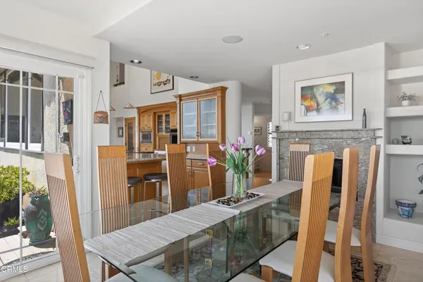 a living room with furniture fireplace and window