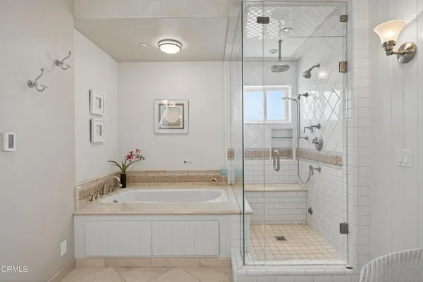 a spacious bathroom with a shower sink mirror and a toilet