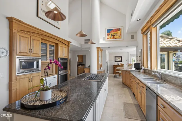 a kitchen with a sink and a refrigerator