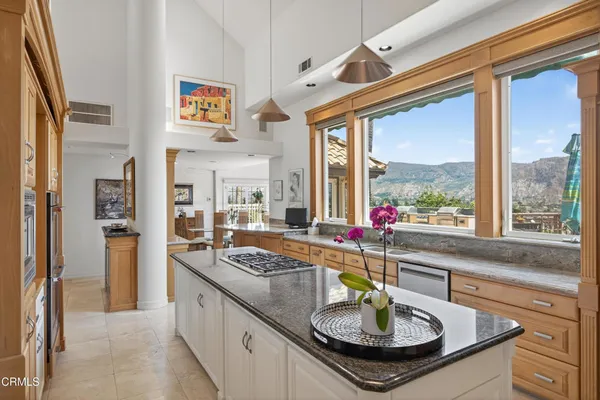 a living room with granite countertop furniture and a large window