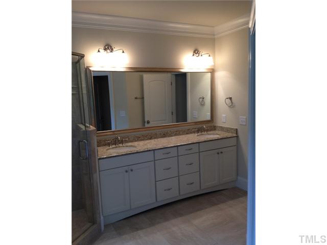 824 Lake Boone Trail Raleigh, NC 27607 - Photo 4 of 8 a bathroom with double vanity and a mirror