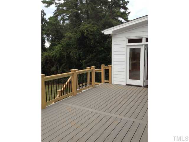 824 Lake Boone Trail Raleigh, NC 27607 - Photo 6 of 8 a balcony of a house with wooden floor and fence