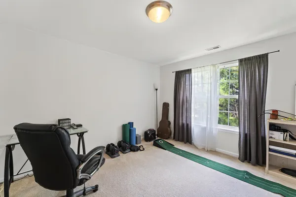 a view of a livingroom with furniture and windows