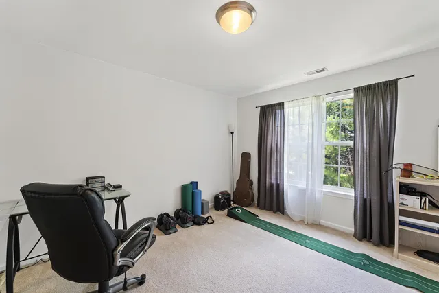 a view of a livingroom with furniture and windows