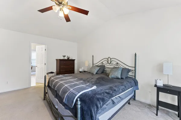 a bedroom with a bed and window