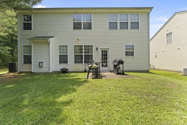 a backyard of a house with seating space