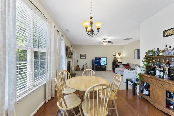 a view of a dining room with furniture and wooden floor
