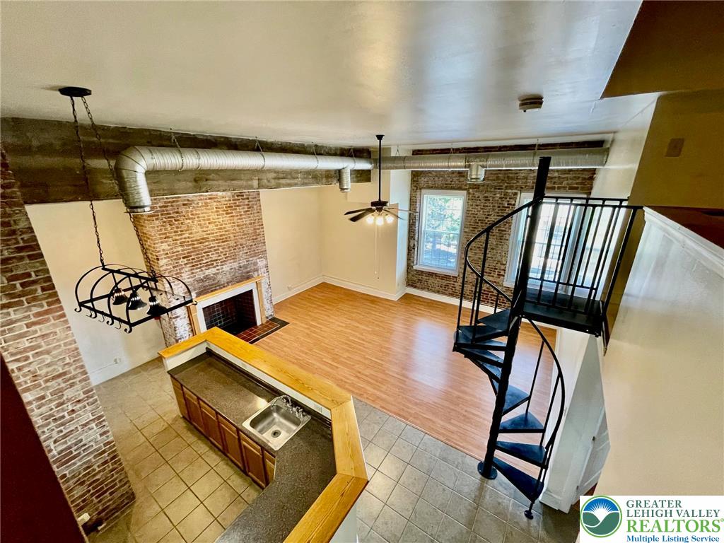 147 South 4th Street, Unit 17 Easton, PA 18042 - Photo 13 of 20 a view of a hallway with furniture and wooden floor
