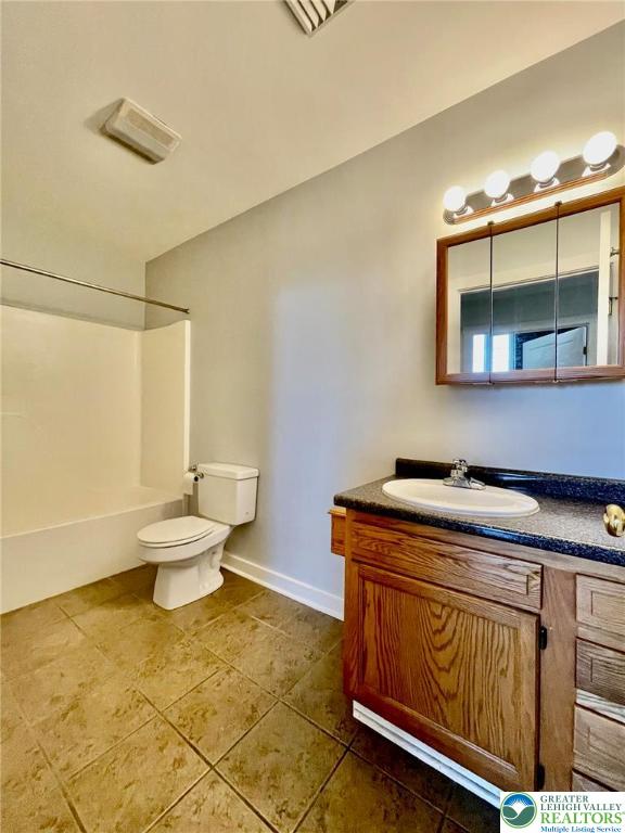 147 South 4th Street, Unit 17 Easton, PA 18042 - Photo 18 of 20 a bathroom with a sink a toilet and mirror