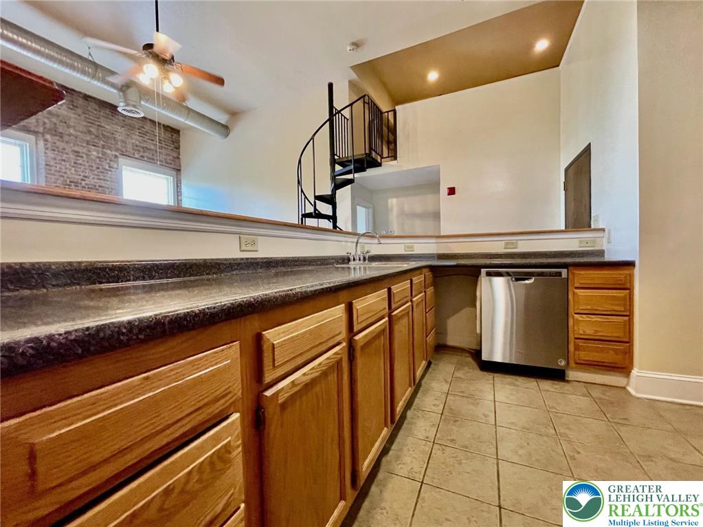 147 South 4th Street, Unit 17 Easton, PA 18042 - Photo 7 of 20 a kitchen with stainless steel appliances granite countertop a sink and cabinets