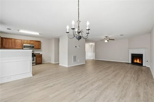 a view of a kitchen and microwave