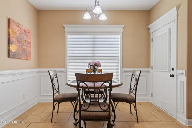 a view of a dining room with furniture and window