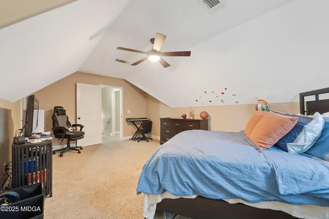 a bedroom with furniture and a window