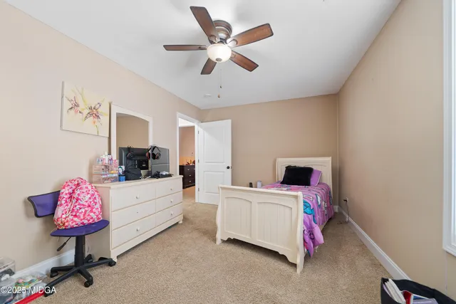 a room with a bed furniture and a window