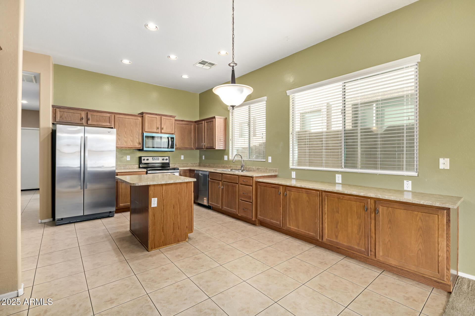 35819 North 33rd Lane Phoenix, AZ 85086 - Photo 14 of 50 a kitchen with stainless steel appliances granite countertop a stove a sink dishwasher a refrigerator and a microwave