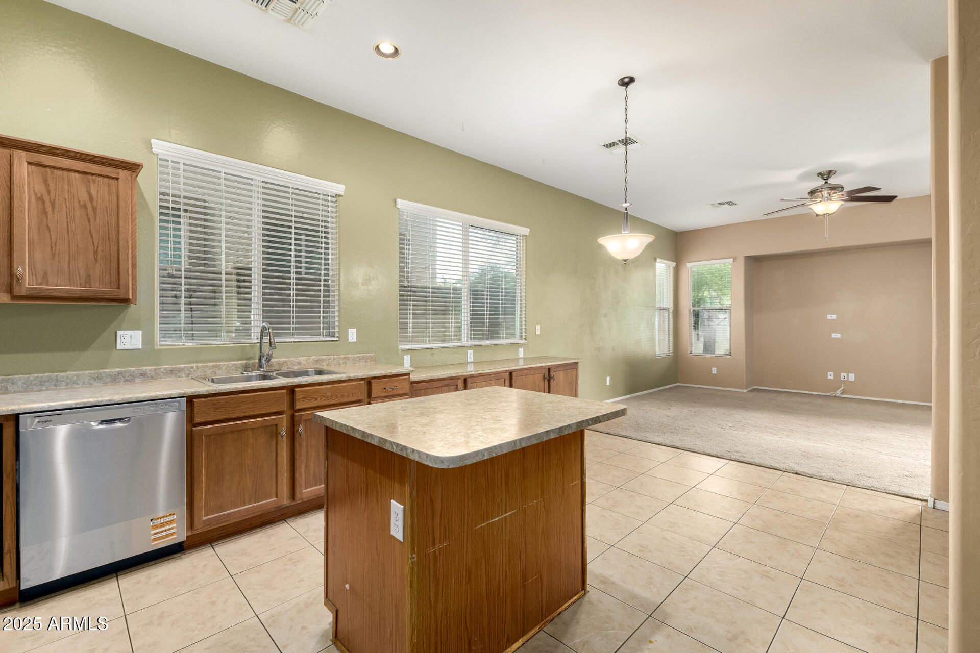 35819 North 33rd Lane Phoenix, AZ 85086 - Photo 17 of 50 a kitchen with granite countertop a sink and a stove