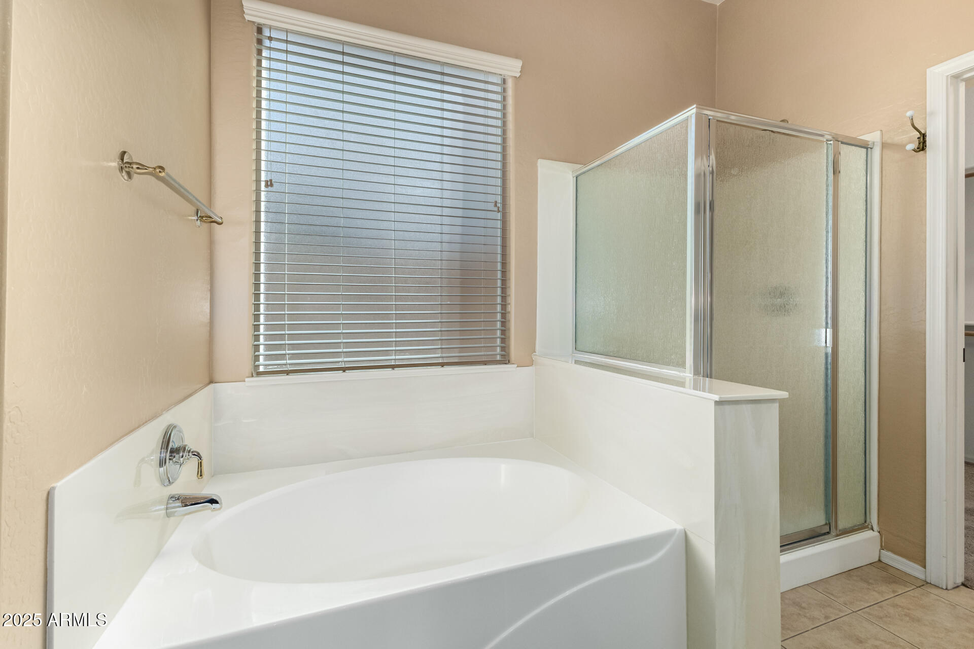 35819 North 33rd Lane Phoenix, AZ 85086 - Photo 23 of 50 a white bath tub sitting under a bathroom window