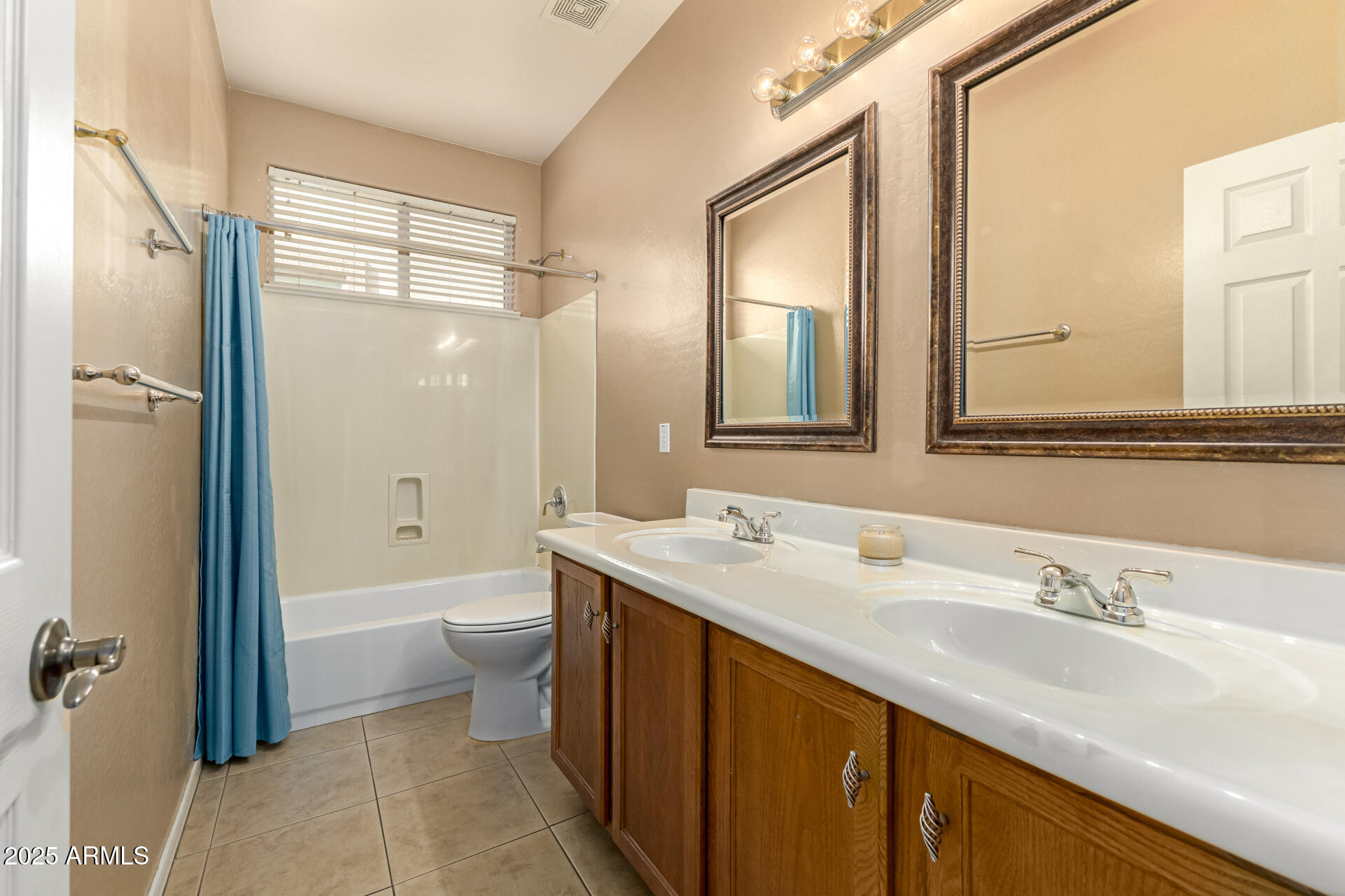 35819 North 33rd Lane Phoenix, AZ 85086 - Photo 29 of 50 a bathroom with a double vanity sink toilet mirror and bathtub