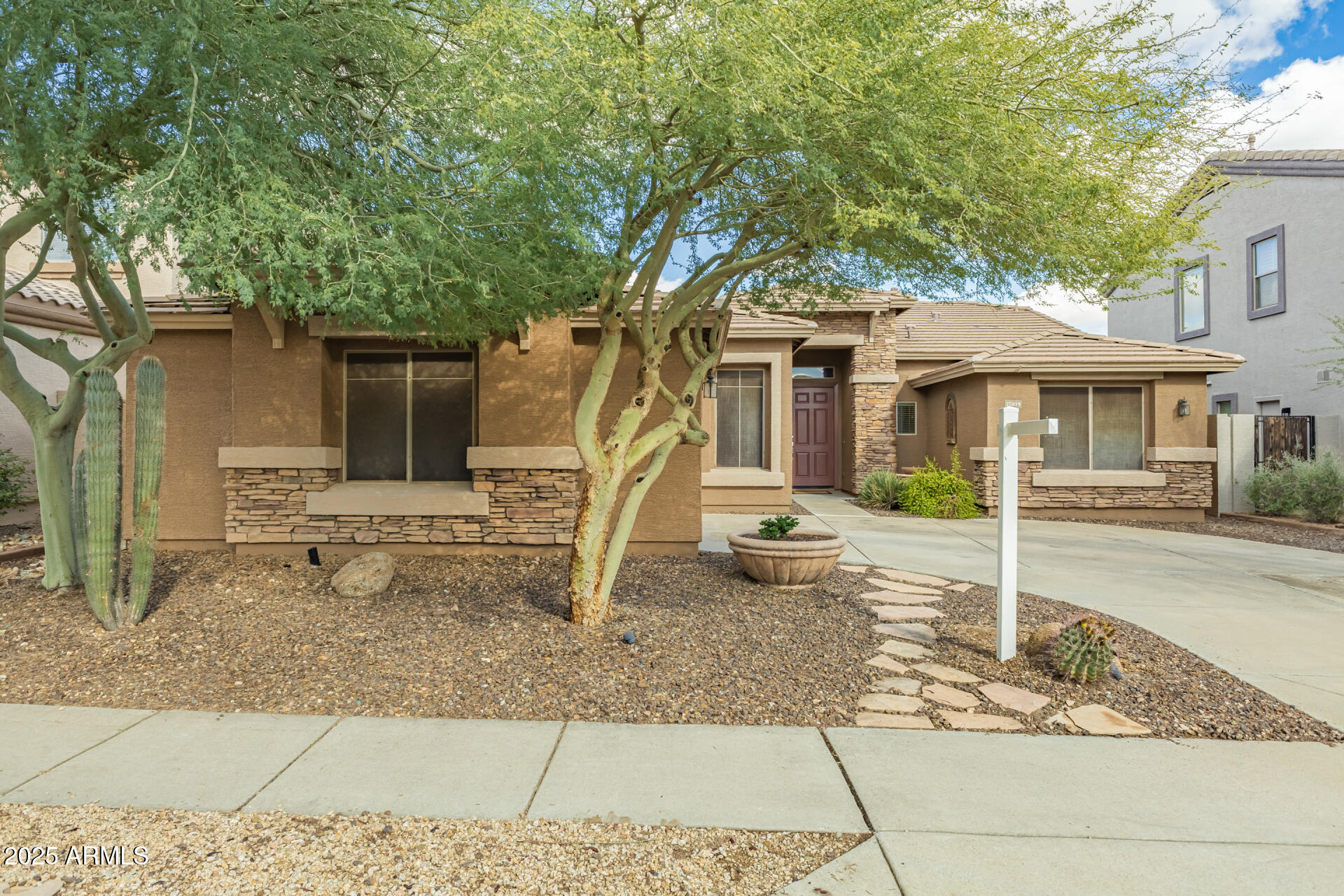 35819 North 33rd Lane Phoenix, AZ 85086 - Photo 3 of 50 a house with trees in the background