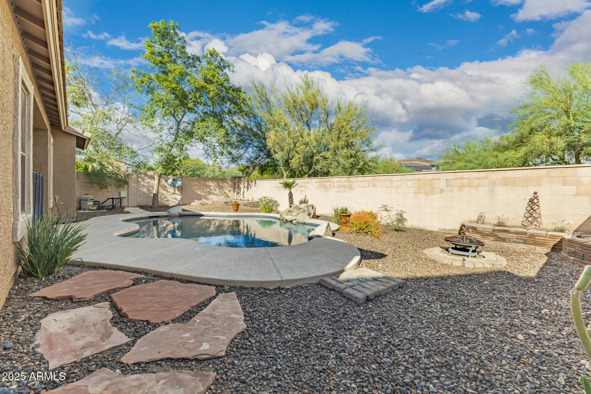 35819 North 33rd Lane Phoenix, AZ 85086 - Photo 40 of 50 a view of a swimming pool with lounge chairs
