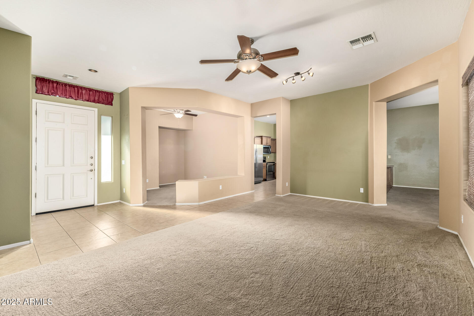 35819 North 33rd Lane Phoenix, AZ 85086 - Photo 5 of 50 a view of a livingroom with a ceiling fan