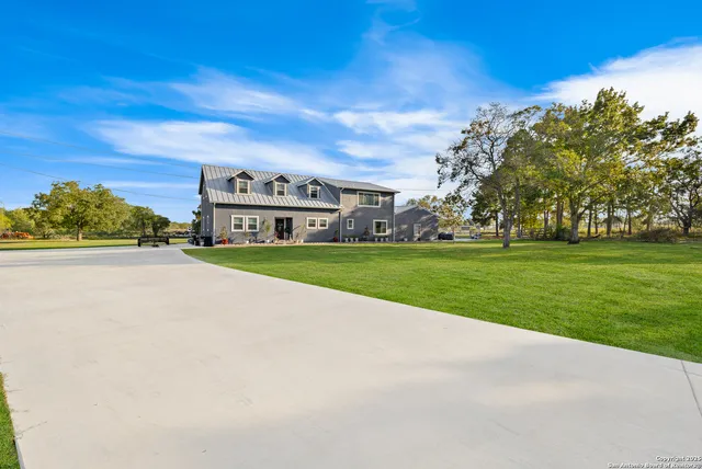 a view of a house with a big yard