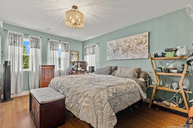 a bed room with a bed and a chair