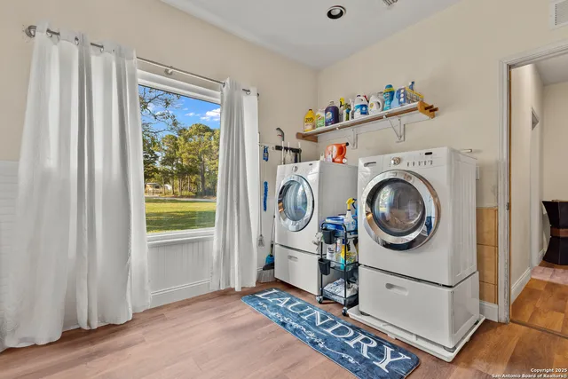 a view of a storage & utility room with washer and dryer