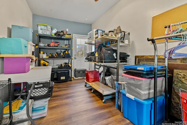 a living room with lots of furniture and clutter