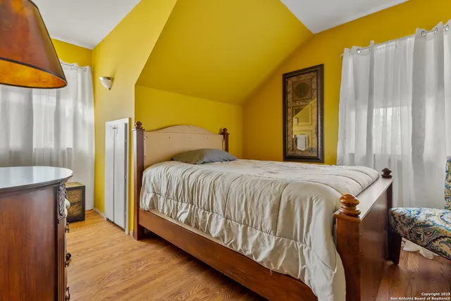 a bedroom with a bed and a dresser