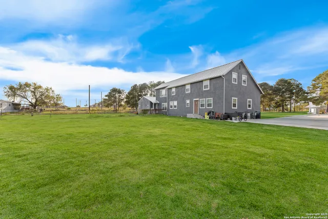 a view of a house with a big yard