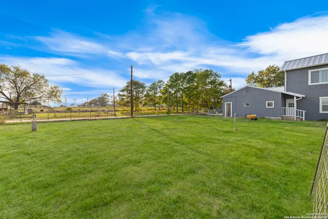 a view of a house with a big yard