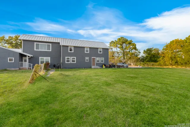 a view of a house with a big yard